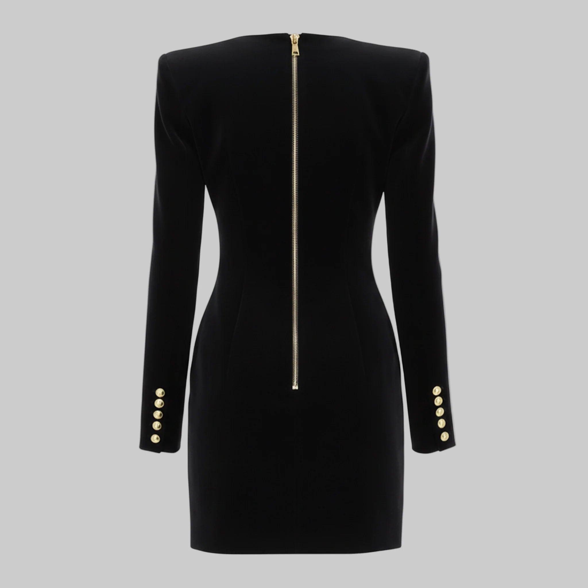 Black dress with gold buttons and zipper on a gray background