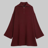 Maroon sweater dress on a white background