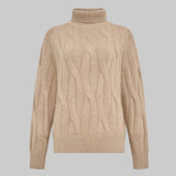 Beige cable knit sweater on a light gray background