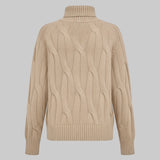 Beige cable knit sweater on a light gray background