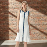 Woman wearing a white dress with blue accents on a gray background