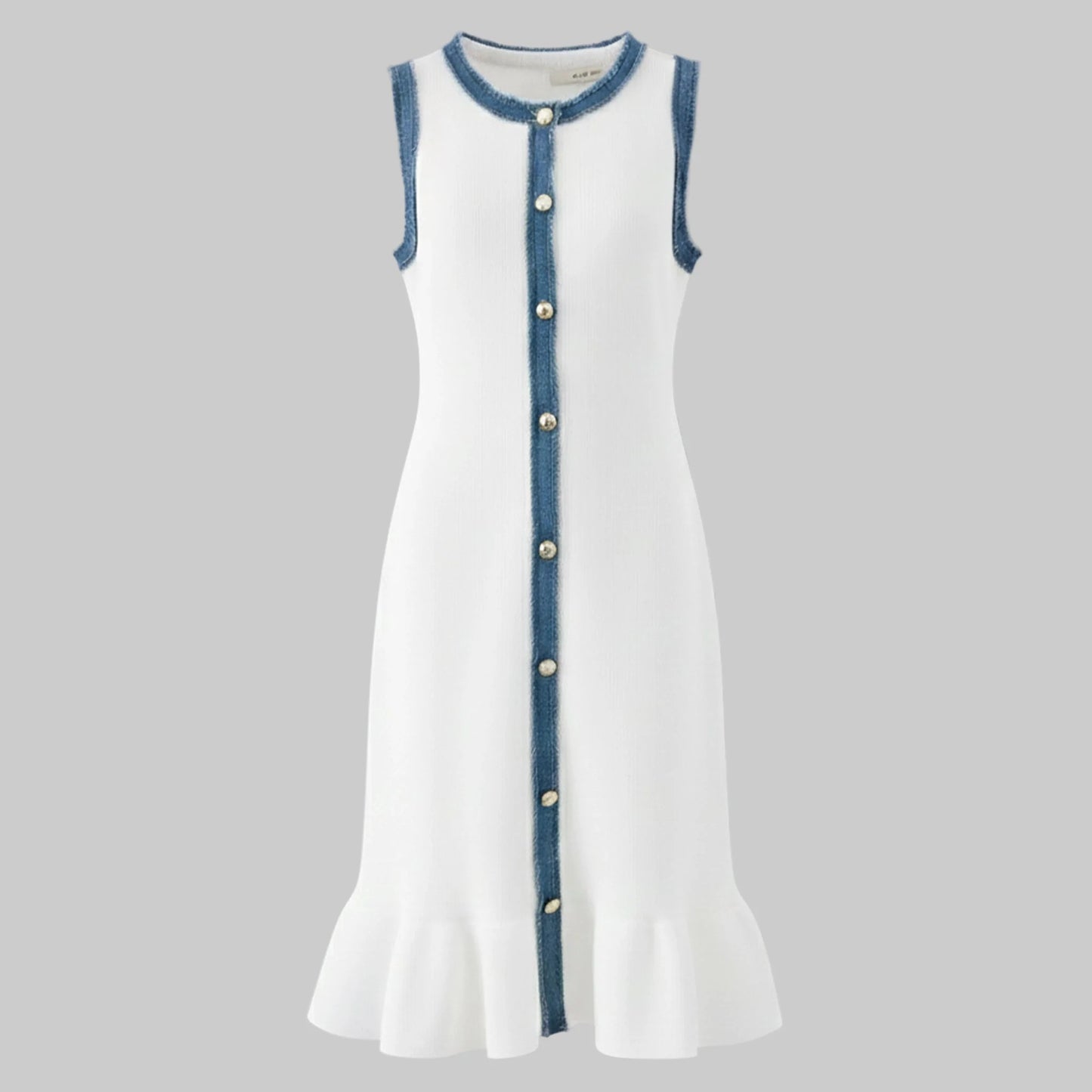 White dress with blue trim and buttons on a gray background