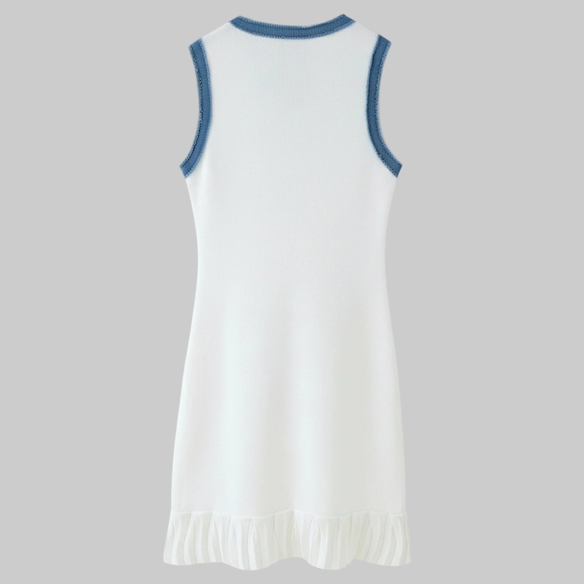 White dress with blue trim on a gray background