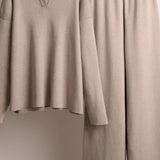 Beige dress on a mannequin against a neutral background