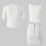 White ribbed crop top and skirt set on a gray background