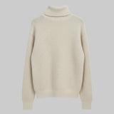 Beige turtleneck sweater on a light gray background