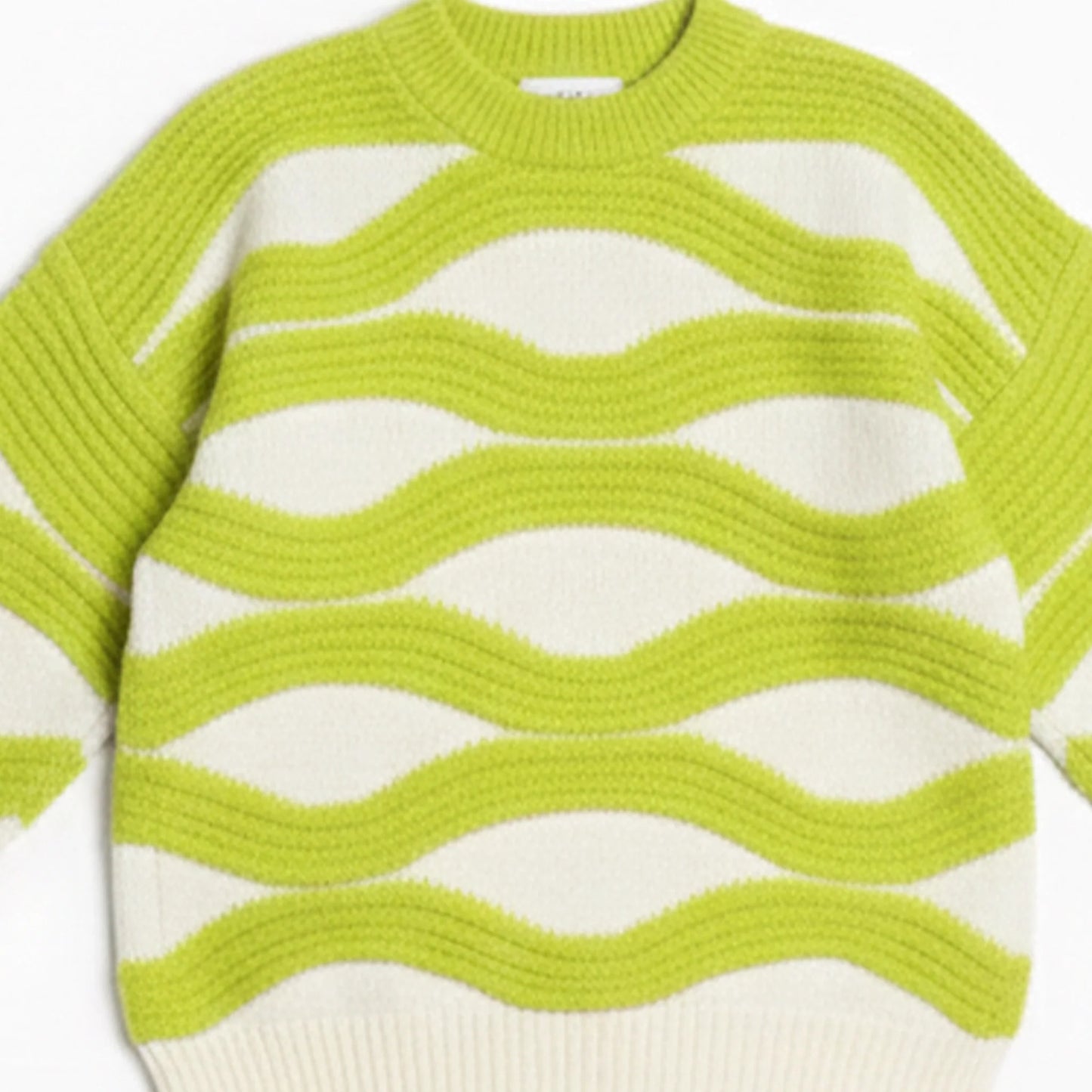 Green and white striped sweater on a white background