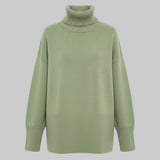 Green turtleneck sweater on a white background