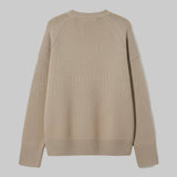 Beige sweater on a light gray background