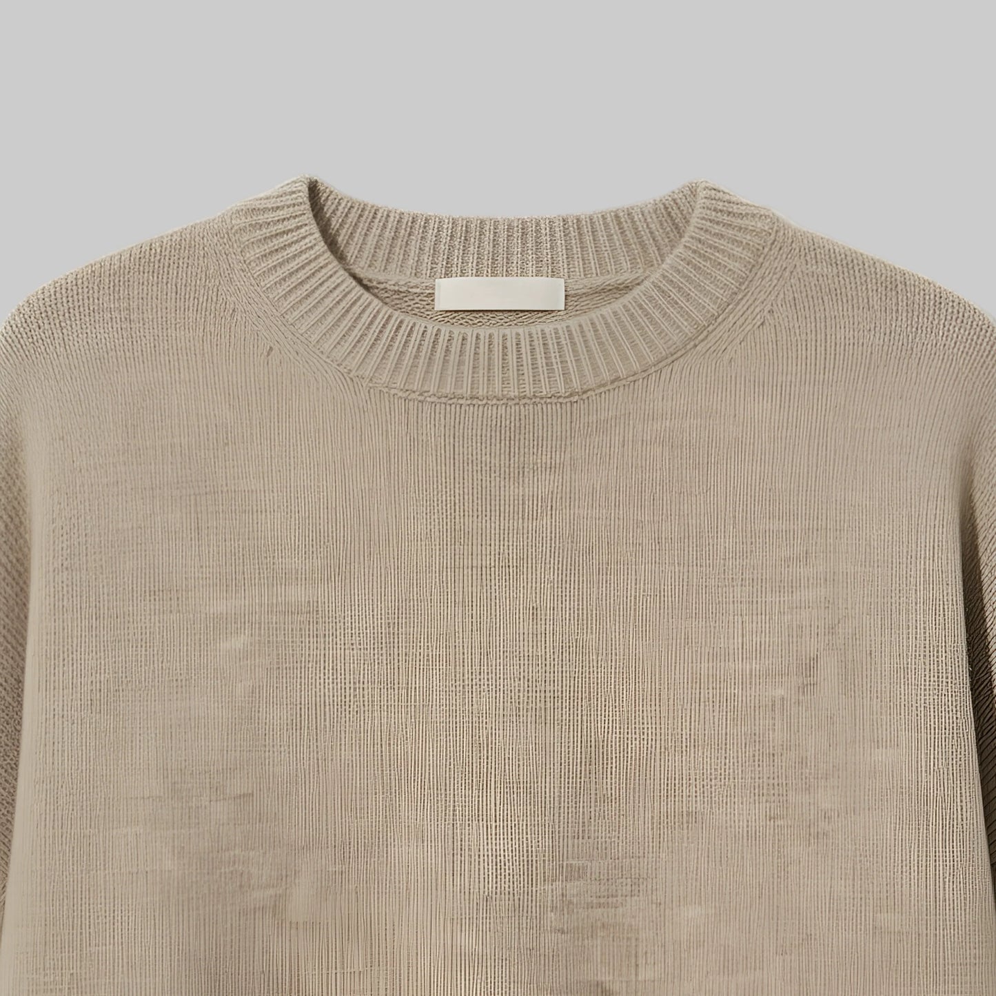 Beige sweater on a light gray background