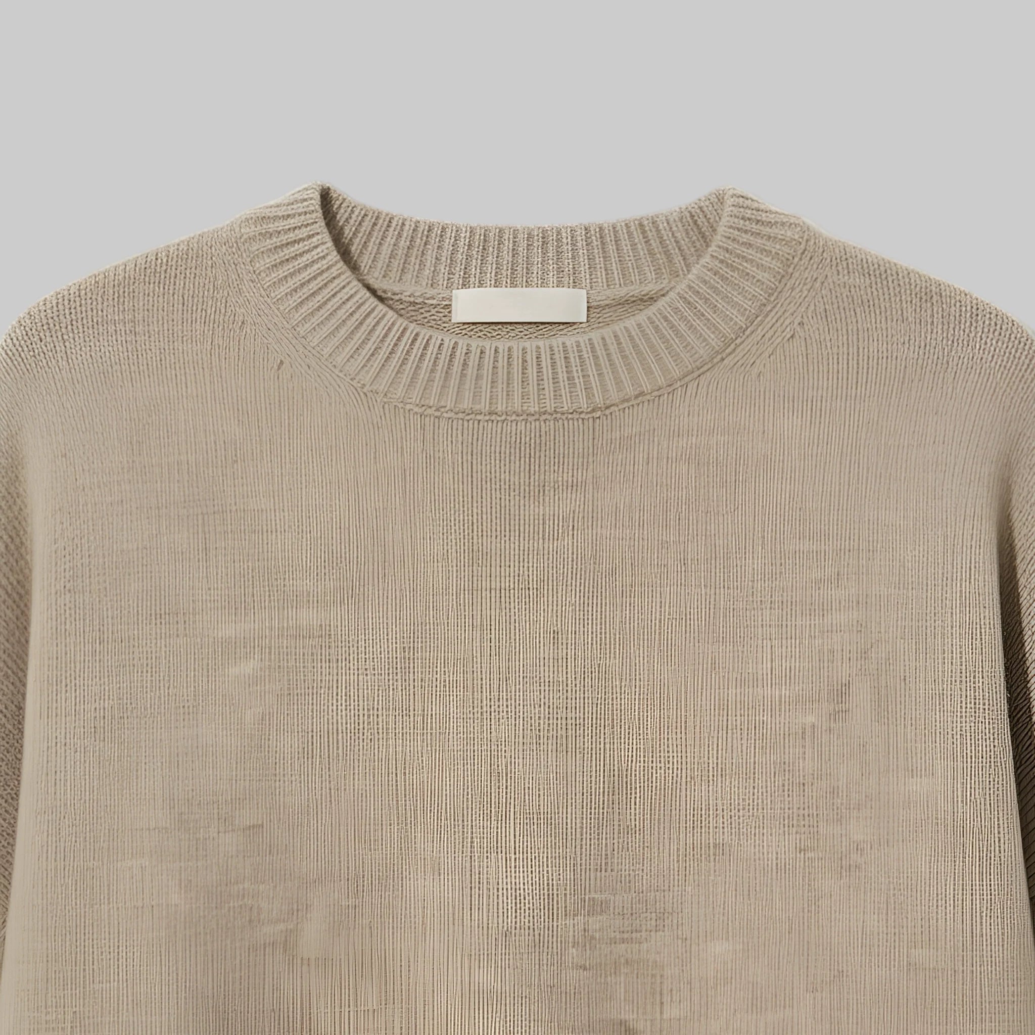 Beige sweater on a light gray background