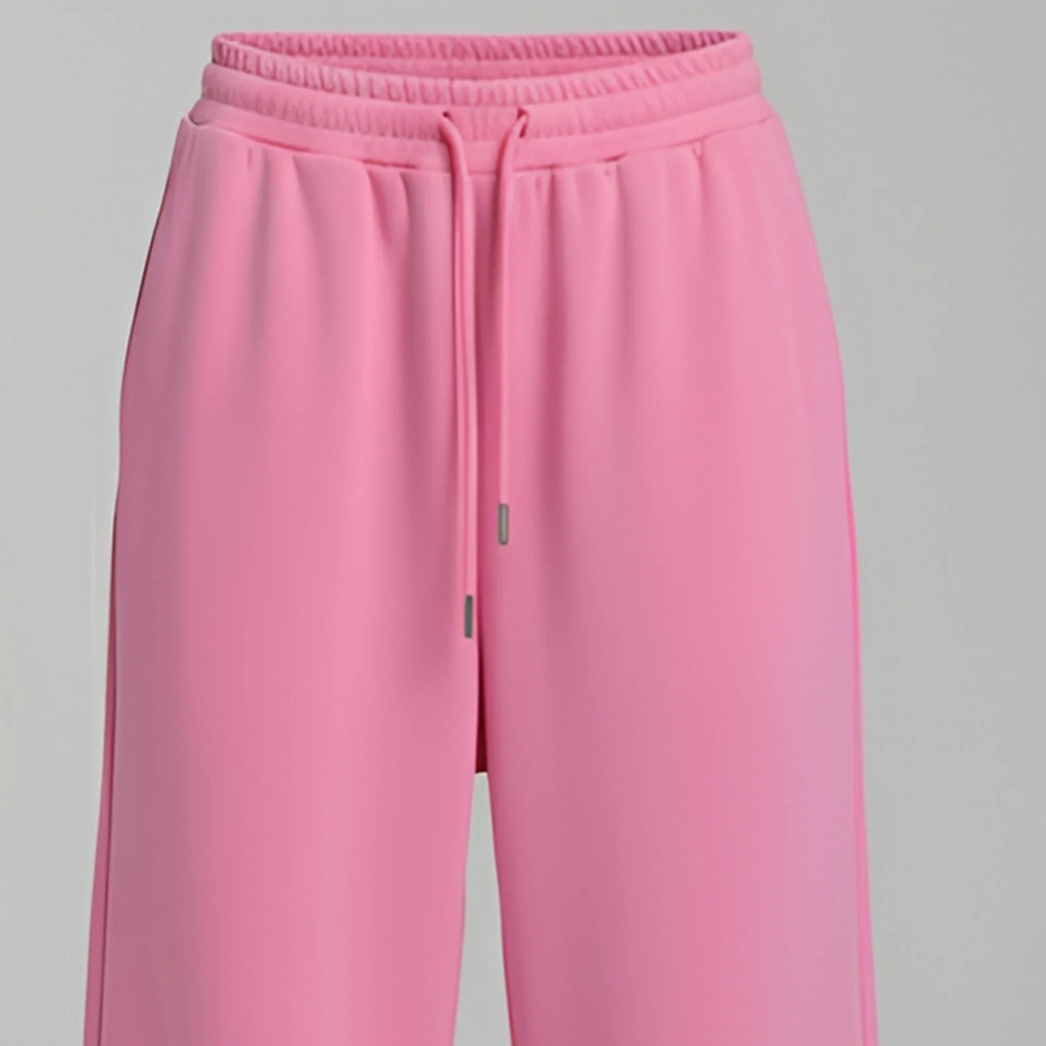 Pink sweatpants on a gray background