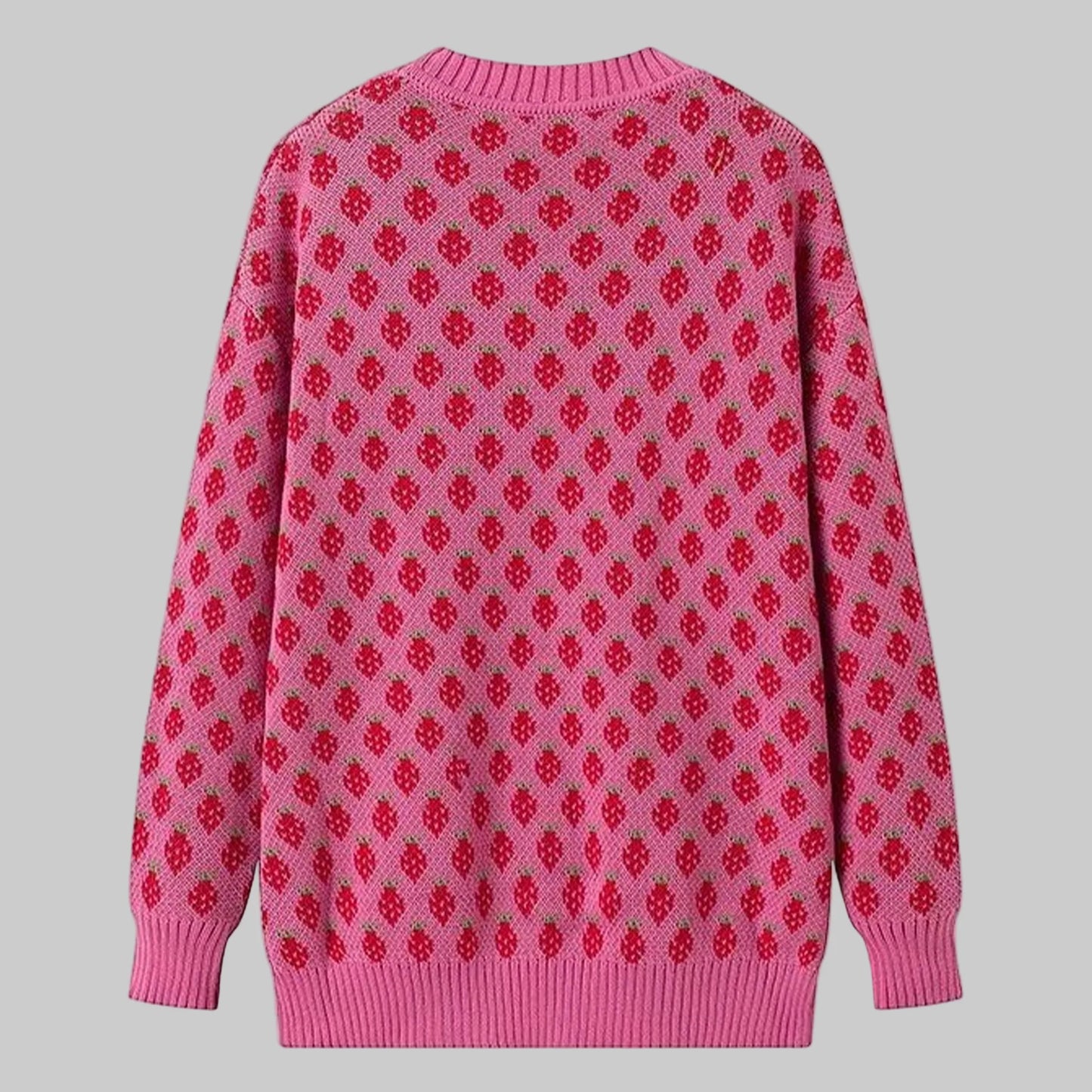 Pink sweater with red pattern on a white background