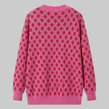 Pink sweater with red pattern on a white background