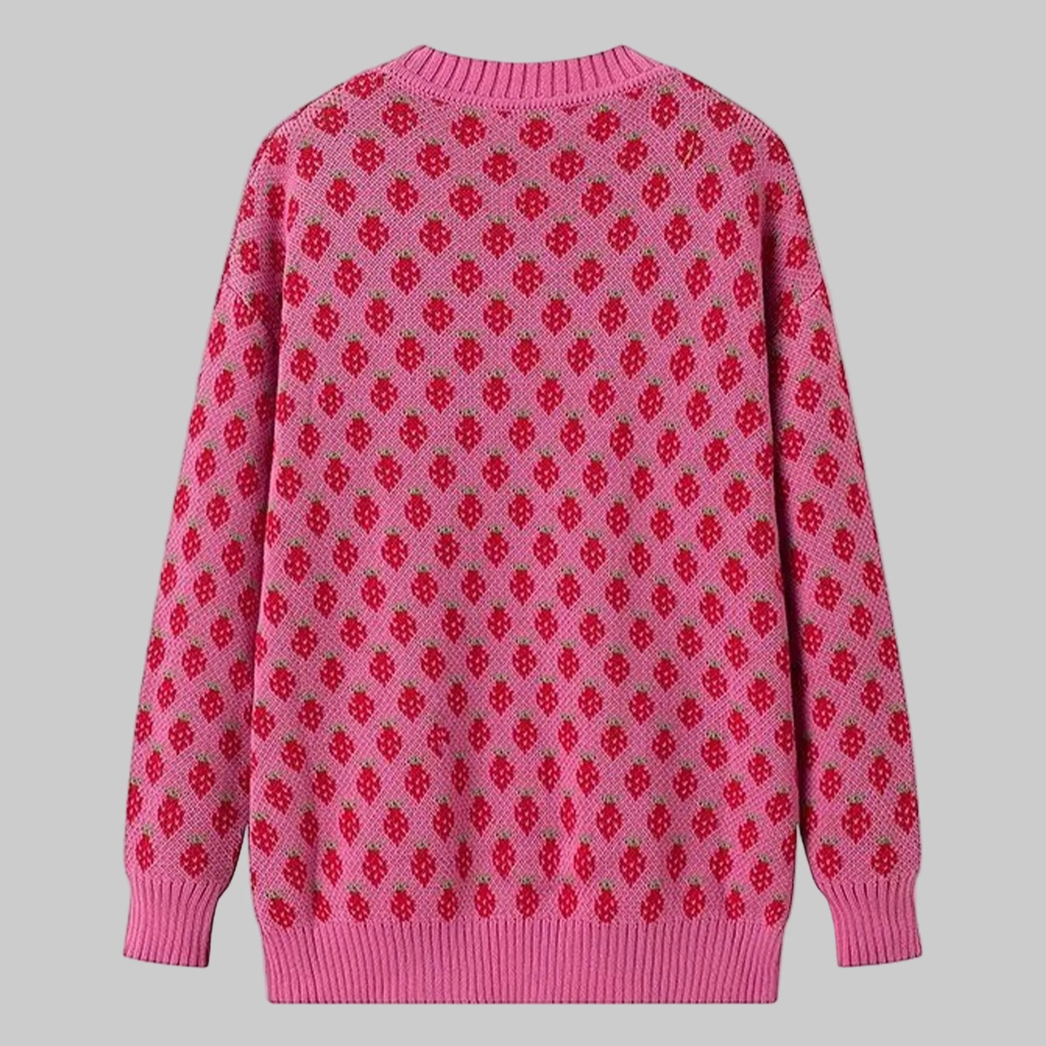 Pink sweater with red pattern on a white background