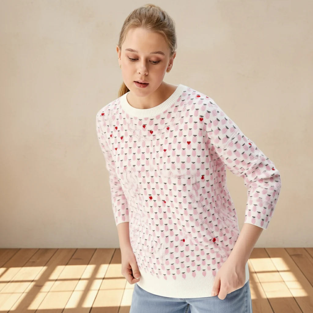 Person wearing a pink patterned shirt on a gray background