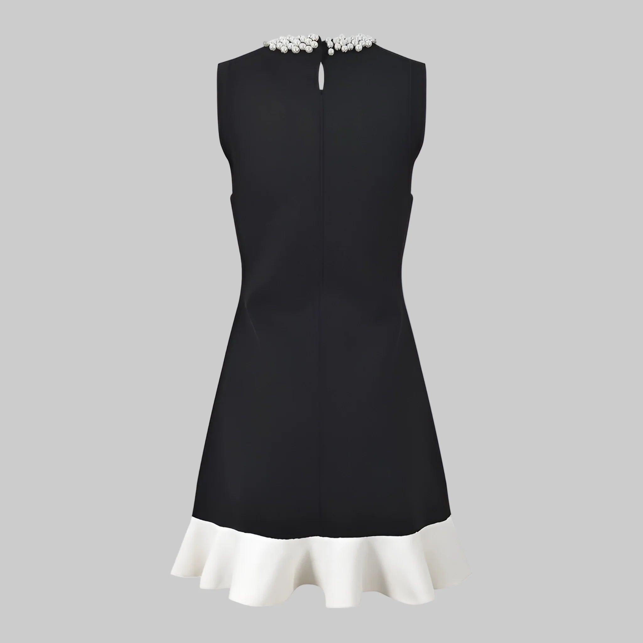 Black dress with white trim on a white background