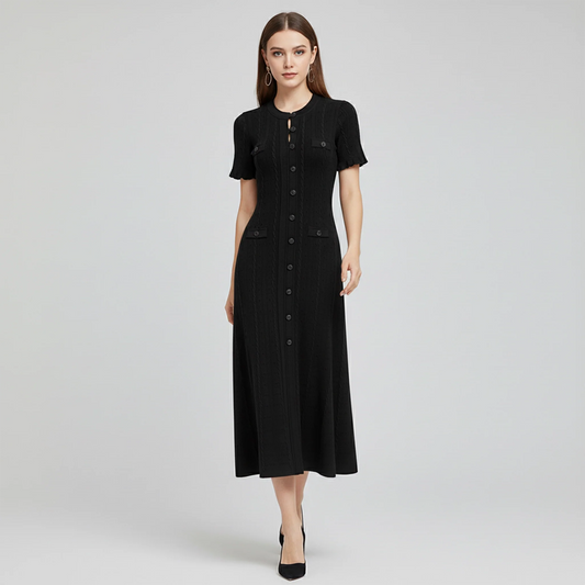 Woman wearing a black dress on a gray background