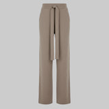 Beige wide-leg pants with a tie waist on a white background