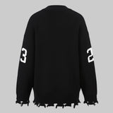Black sweater with white numbers on a white background