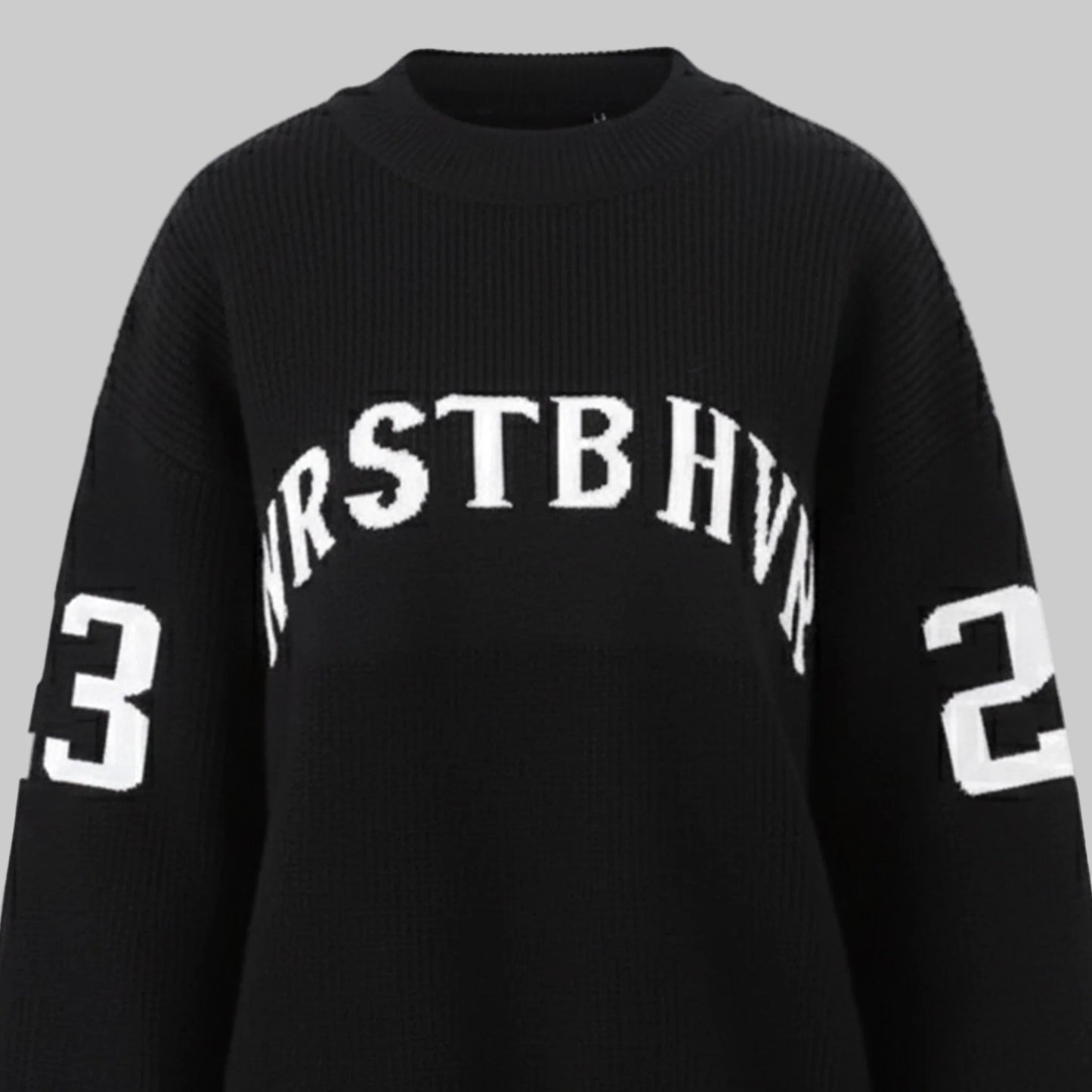 Black sweater with white text and numbers on a white background