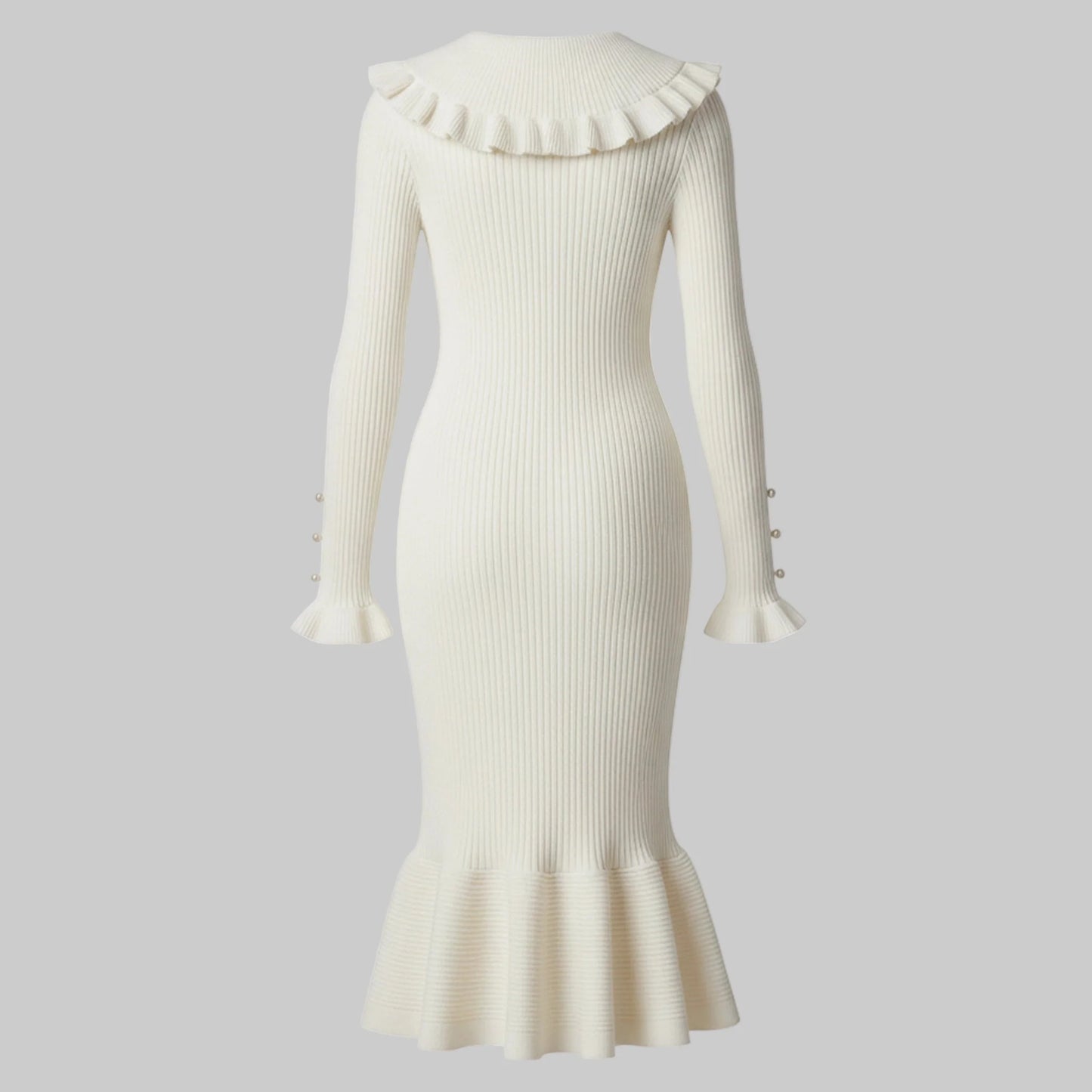 White ribbed dress with ruffled collar and hem on a white background