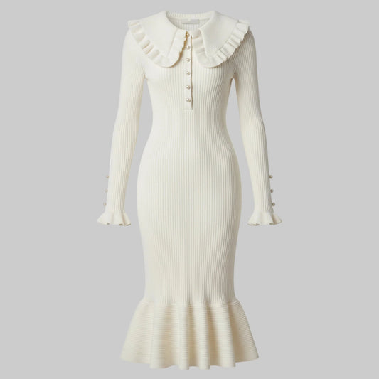 White ribbed dress with ruffled collar on a white background